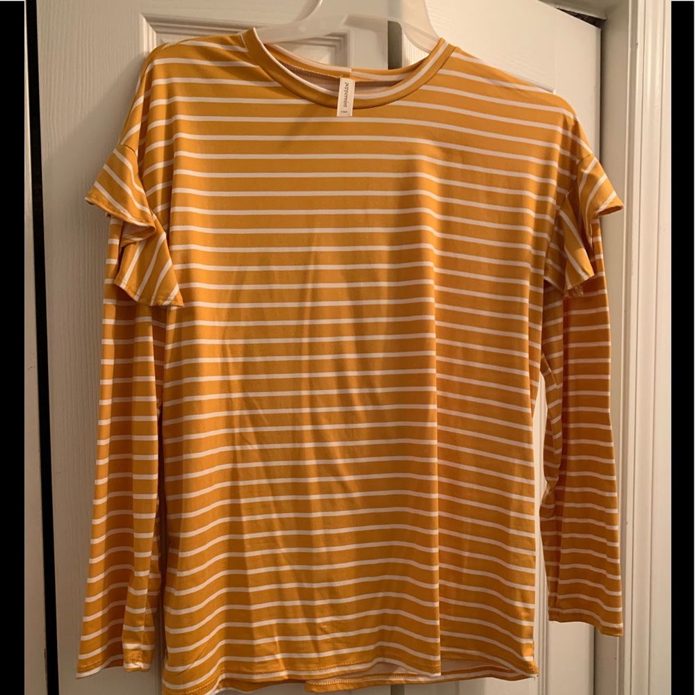 Popular gold colored, ruffle sleeved blouse.